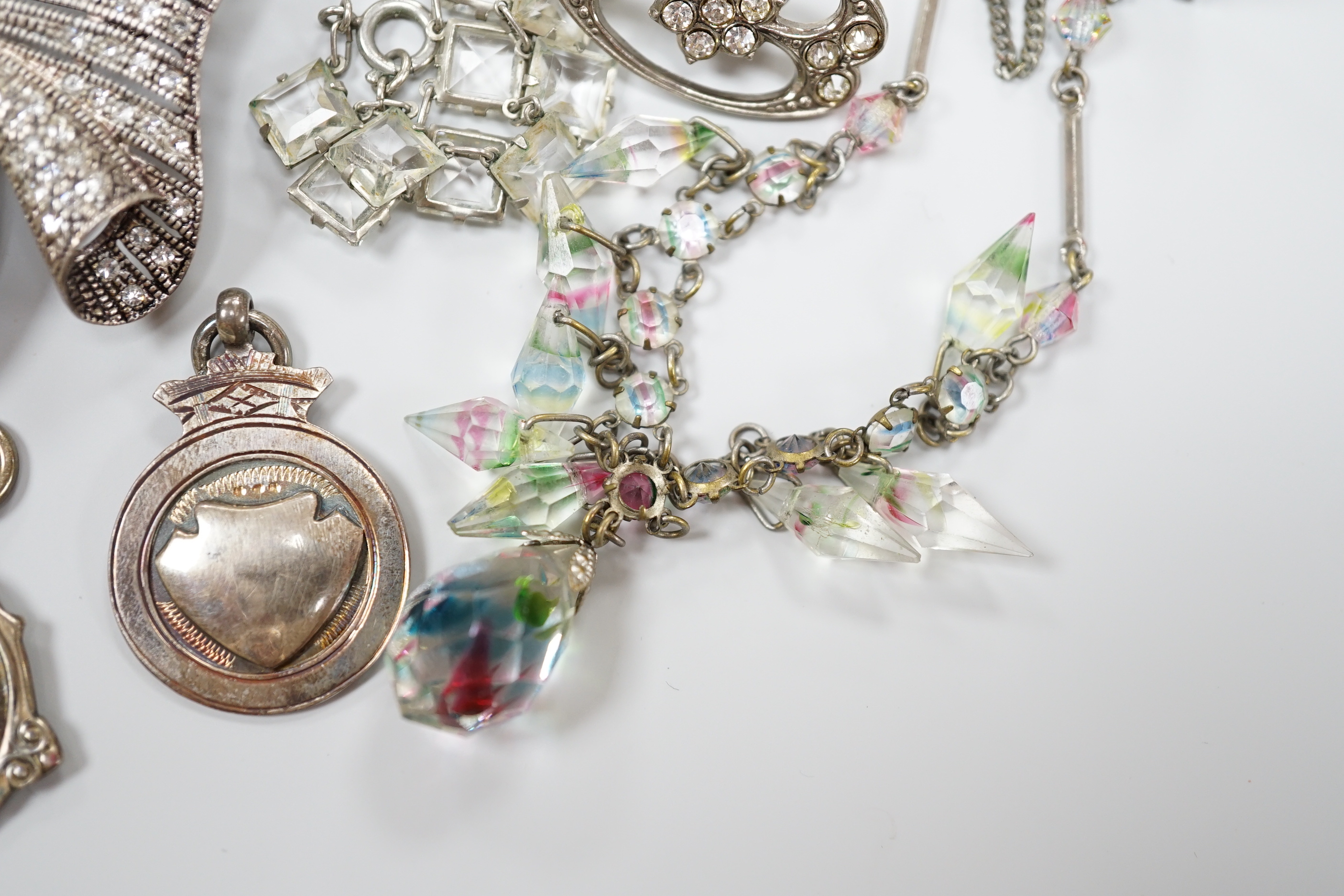 A small collection of assorted costume jewellery including a marcasite set pendant necklace.